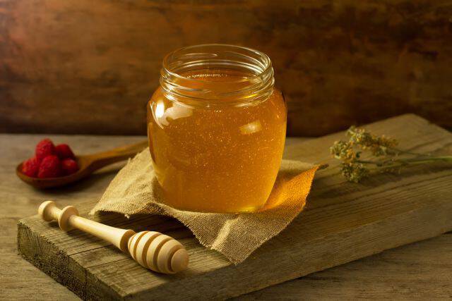 bigstock Glass Jar Of Honey With A Driz 95514335