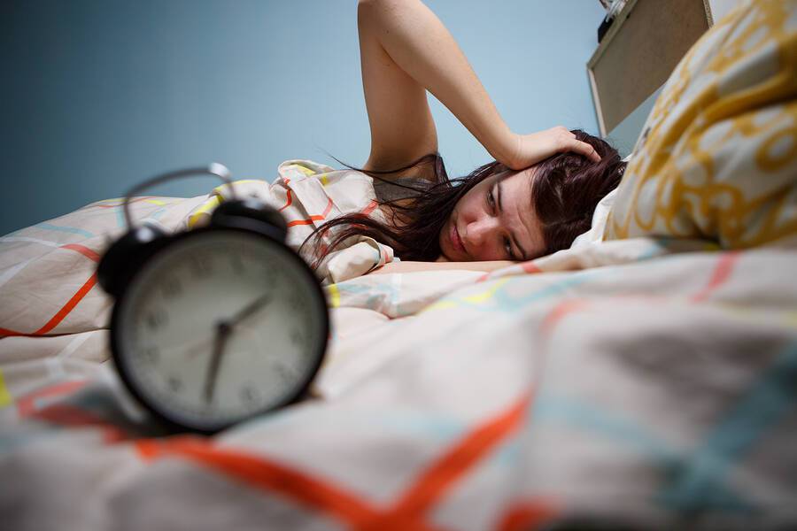 bigstock-Woman-with-insomnia-touching-h-122225789