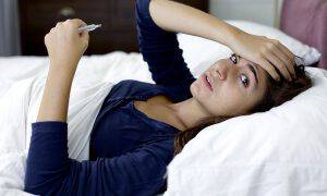 bigstock-Sad-Woman-With-Flu-In-Bed-Look-82743605