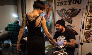 bigstock-Tattoer-And-A-Girl-At-Milano-T-59414111