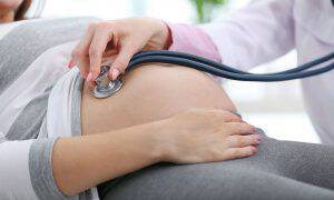 bigstock-Doctor-examining-the-pregnant-139319480