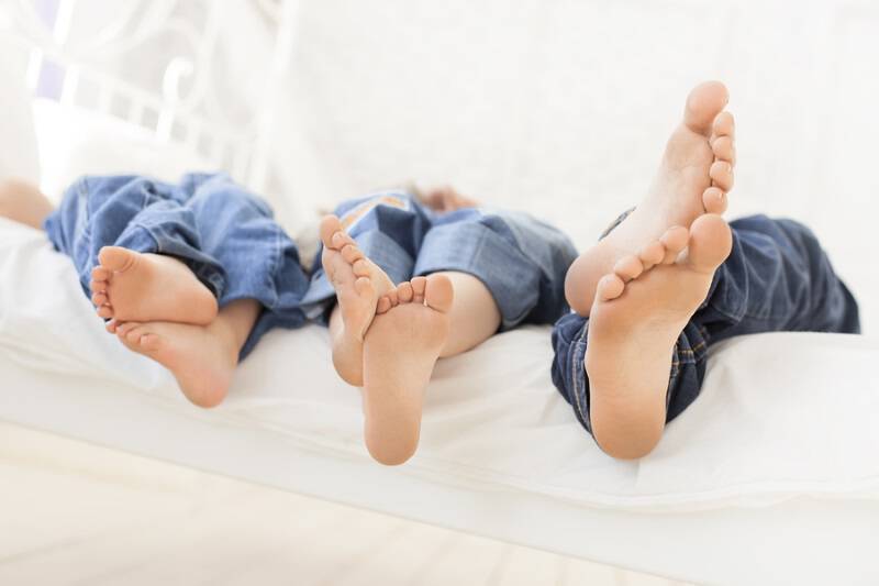 bigstock clear children foot on bed 88959860