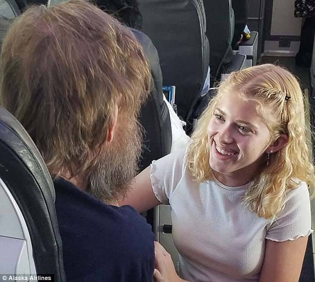Clara Daly (right), 15, has become a viral sensation on social media after her act of kindness to help deaf and blind man Tim Cook (left) on a six-hour flight from Boston to Portland last week
