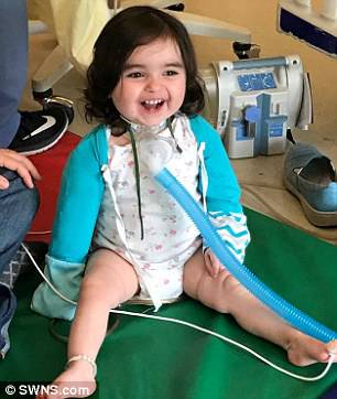 Three weeks later, with no trach and no ventilator, Mae walked out of the hospital, ready to finally go home. Pictured: Mae in the days after the transplant