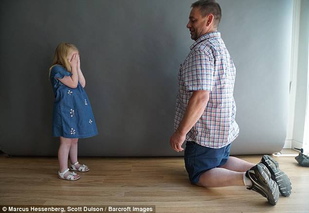 John (pictured playing with Grace at a recent photo shoot) claims his daughter, Grace has always come through everything she has had to face