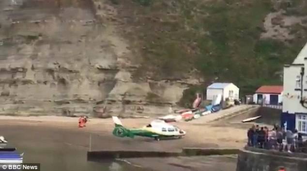 A nine-year-old girl has died from serious head injuries after a rock slide from cliffs in the seaside village of Staithes, North Yorkshire