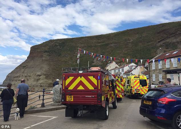 Emergency crews scrambled to the sand to rescue what was reported as trapped beachgoers
