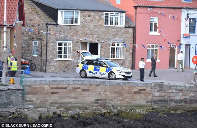 Police remain in the area under the red, white and blue bunting in the Yorkshire town as residents struggle to come to terms with what happened