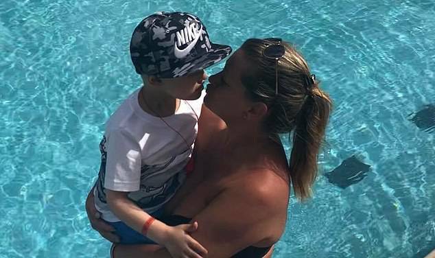 Charlie's heartbroken mother Amber Schofield is pictured swimming with her son on holiday before his rare cancer spread to other parts of his bodyÃÂ 