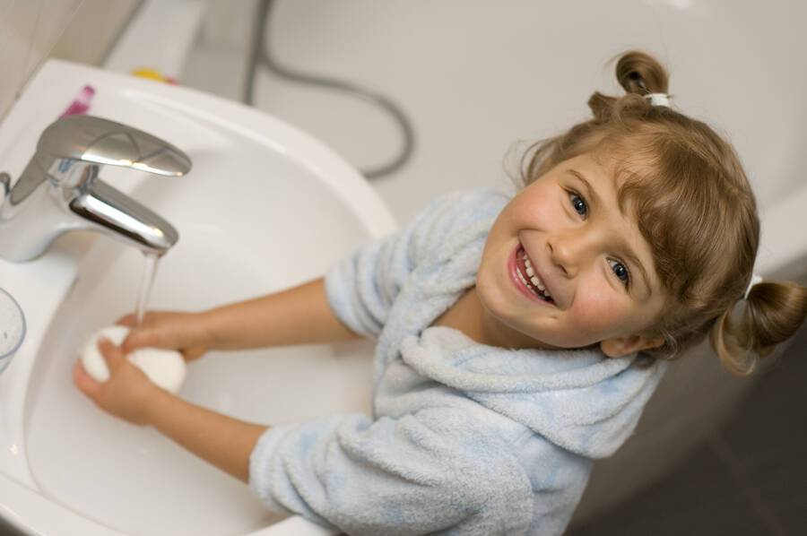 bigstock Little girl washing hands in b 16360082