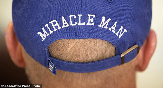 T. Scott Marr wears a miracle man hat during a press conference in Omaha, Nebraska. Thought to be brain dead, Marr awakened after being taken off life support